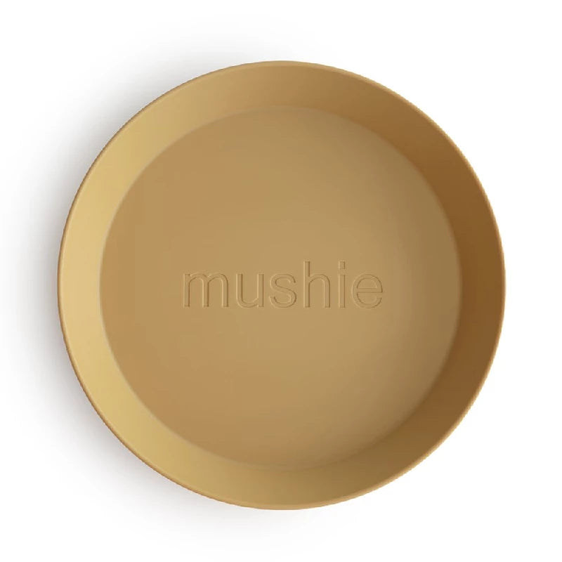 Mushie Rund Tallerken Mustard 2-pak - Stilfuld Spiseoplevelse